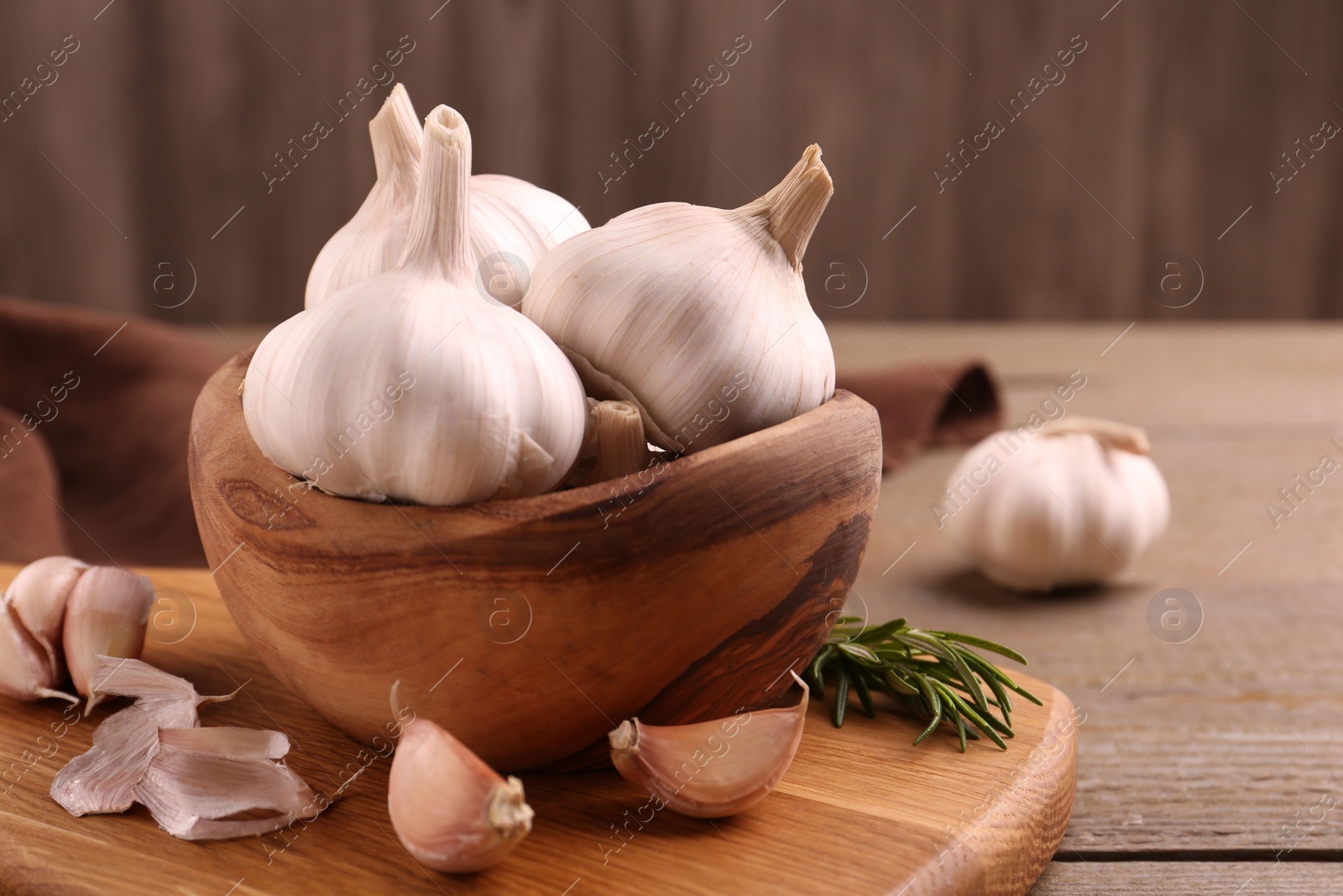 Photo of Fresh garlic on wooden table, closeup view