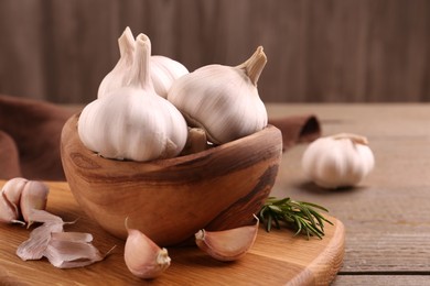 Fresh garlic on wooden table, closeup view