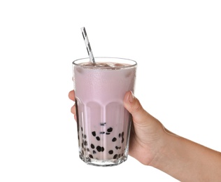 Woman holding glass of bubble milk tea with tapioca balls on white background, closeup