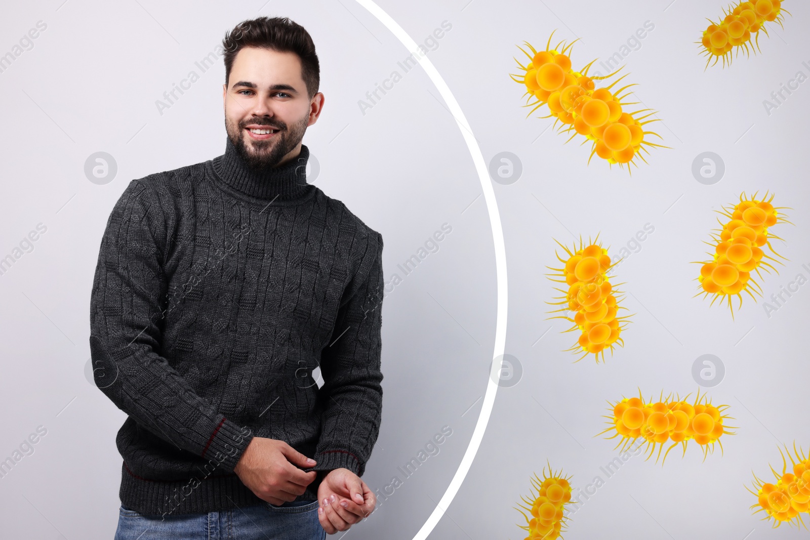 Image of Man with strong immunity surrounded by viruses on grey background