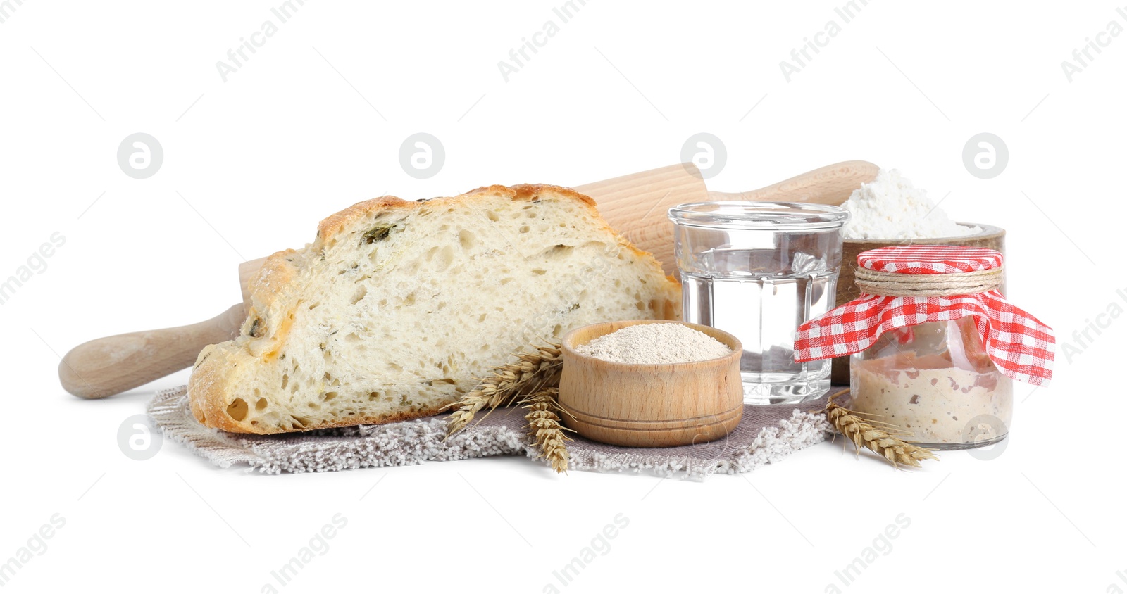 Photo of Freshly baked bread, sourdough and other ingredients on white background