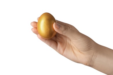 Photo of Woman holding golden egg on white background, closeup