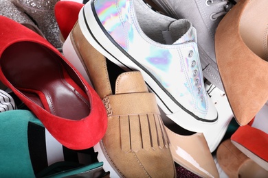 Photo of Different colorful female shoes as background, closeup