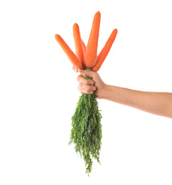 Photo of Woman holding bunch of fresh ripe carrots on white background, closeup