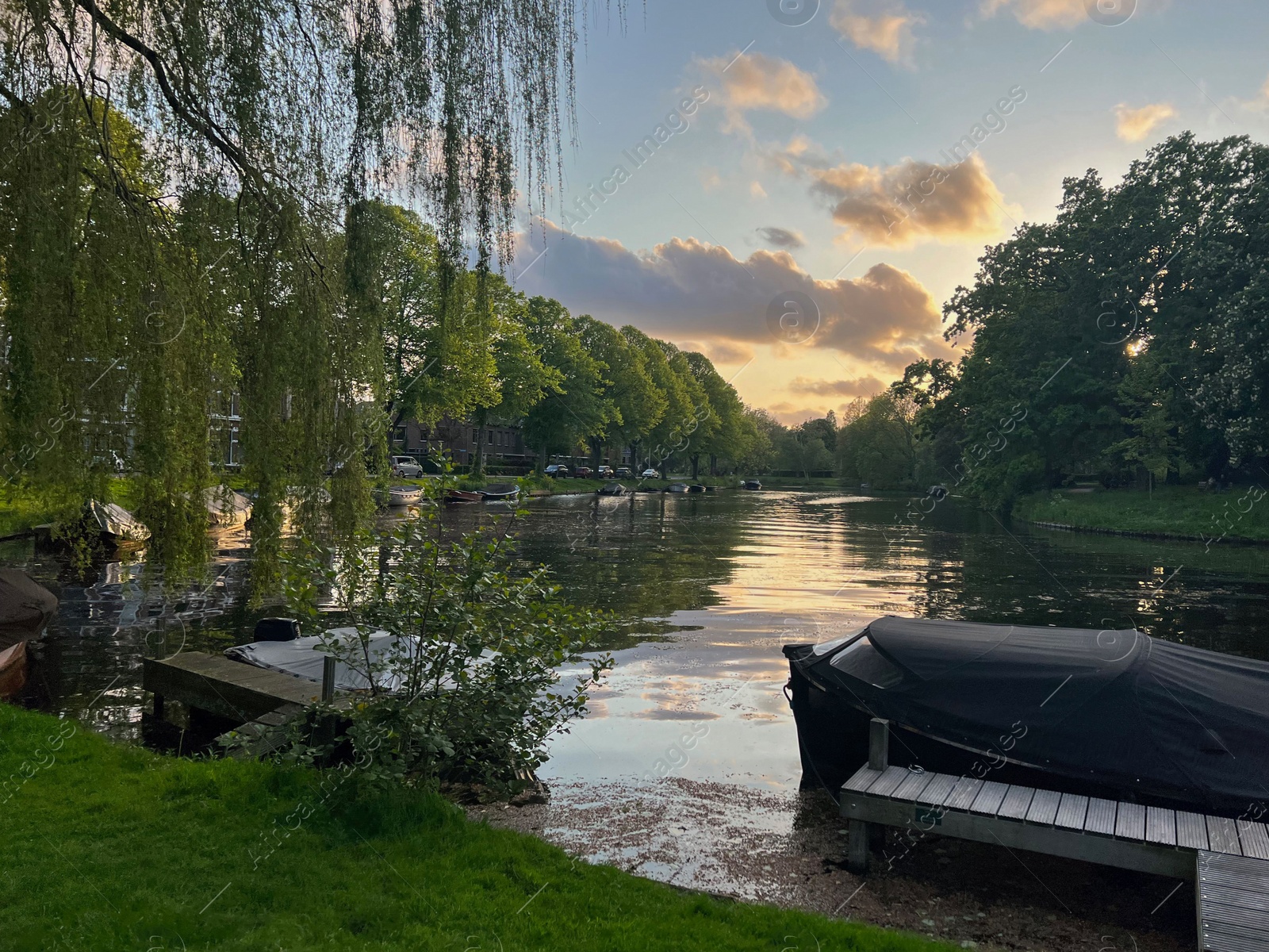 Photo of Beautiful view of canal with moored boats outdoors on spring day