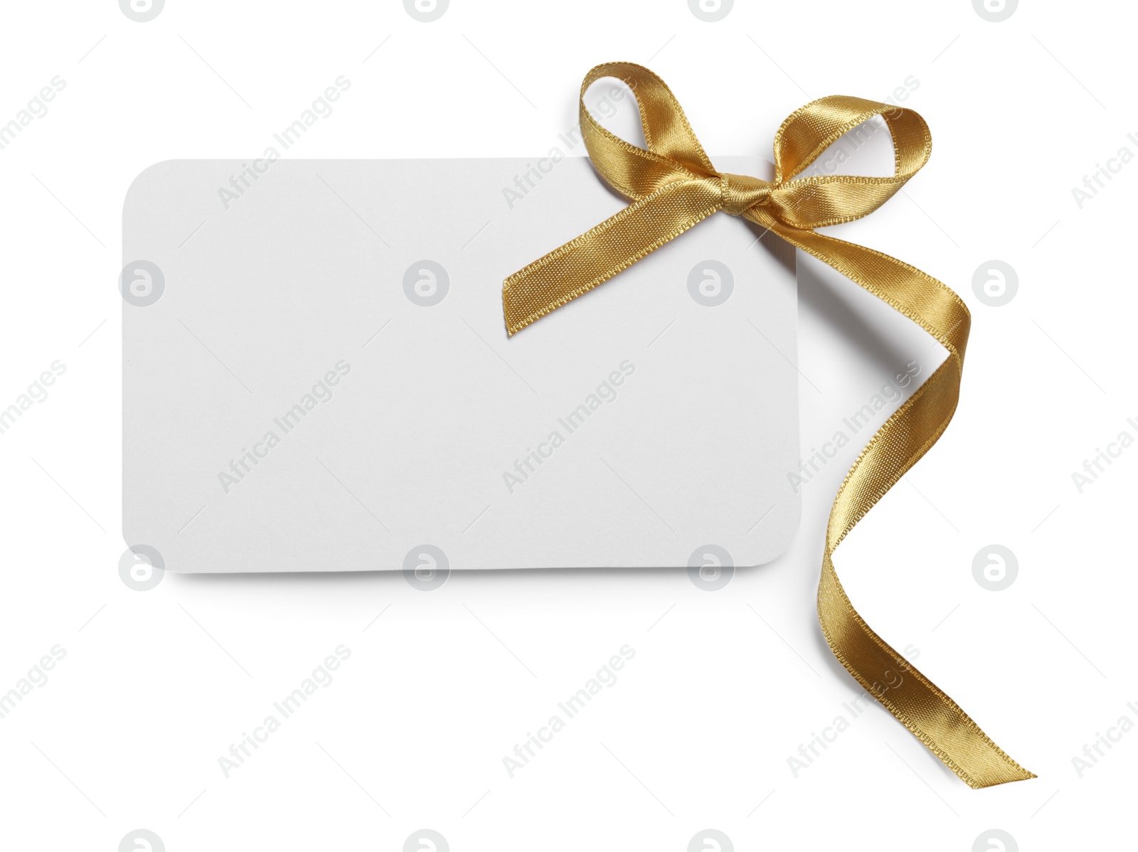 Photo of Blank gift card with golden bow isolated on white, top view