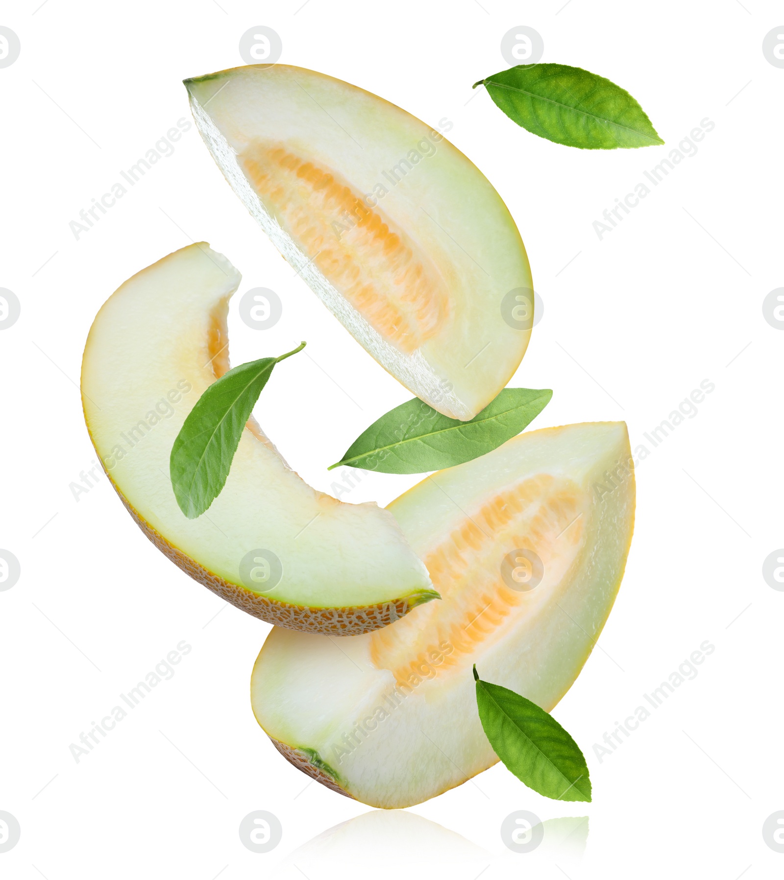 Image of Delicious ripe melon slices and leaves falling on white background