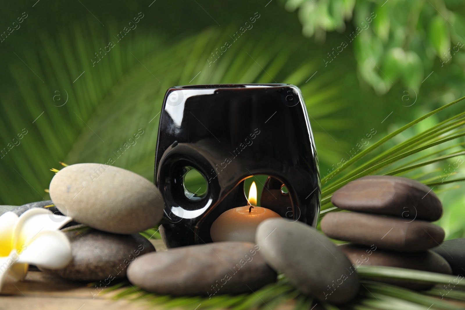 Photo of Composition with stones on table against blurred background. Zen concept