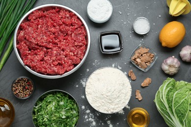 Flat lay composition with ingredients for gyoza on black table