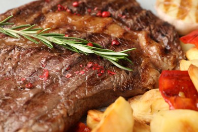 Photo of Delicious grilled beef steak and vegetables, closeup