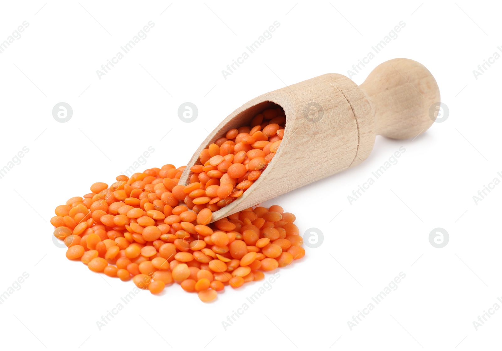 Photo of Wooden scoop with raw lentils isolated on white