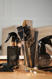 Set of hairdresser tools on table in salon