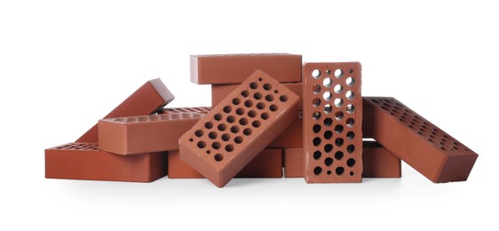 Photo of Pile of red bricks on white background. Building material