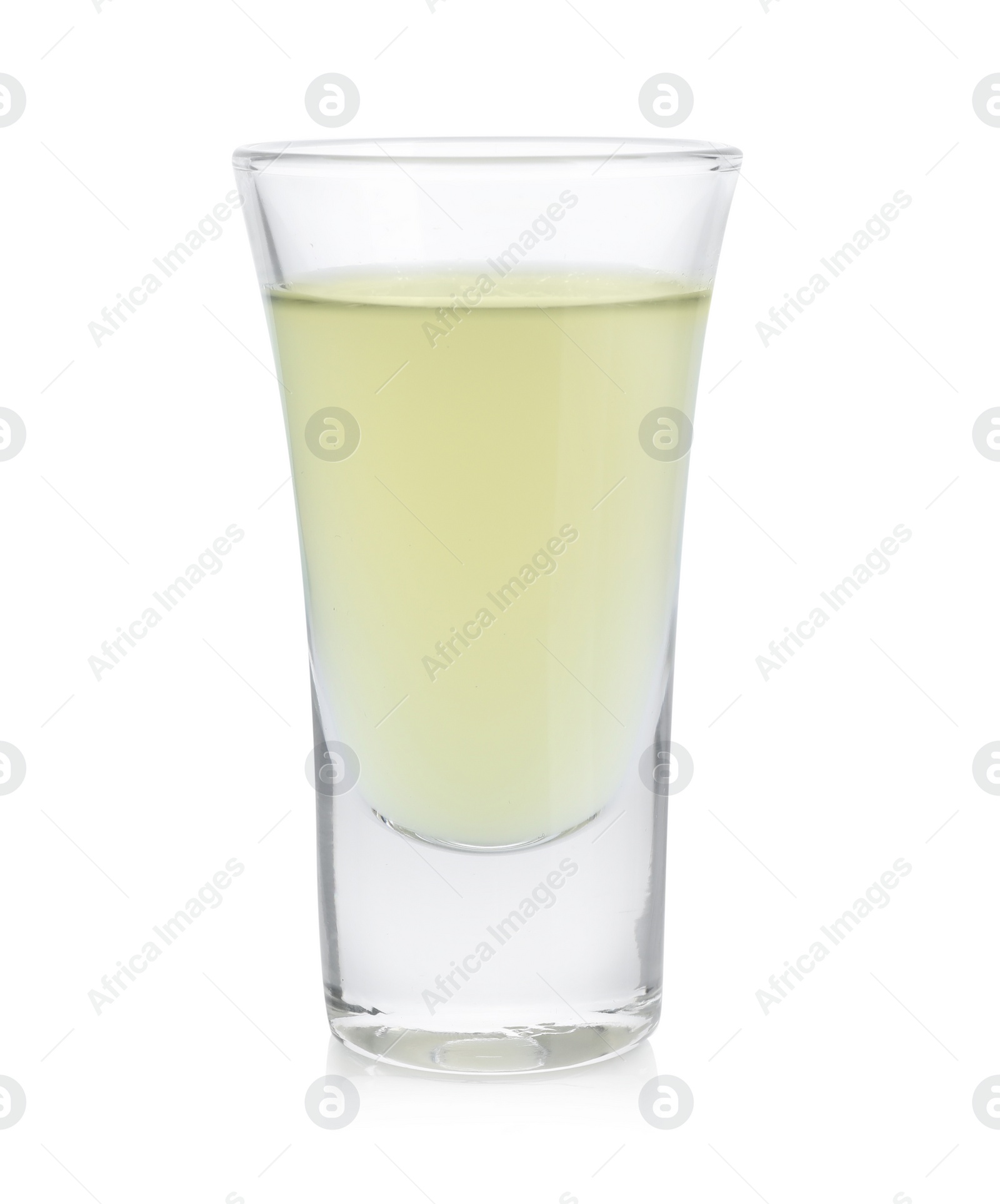 Photo of Shooter in shot glass isolated on white. Alcohol drink