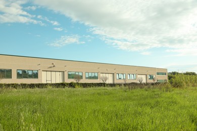 Photo of Exterior of factory building on sunny day