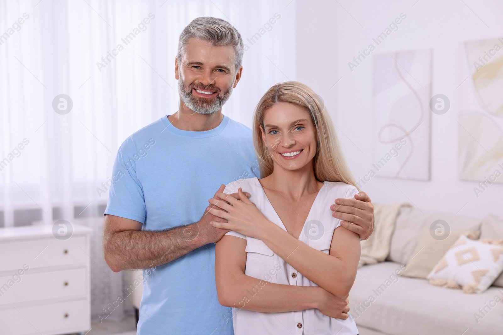 Photo of Portrait of happy affectionate couple at home. Romantic date