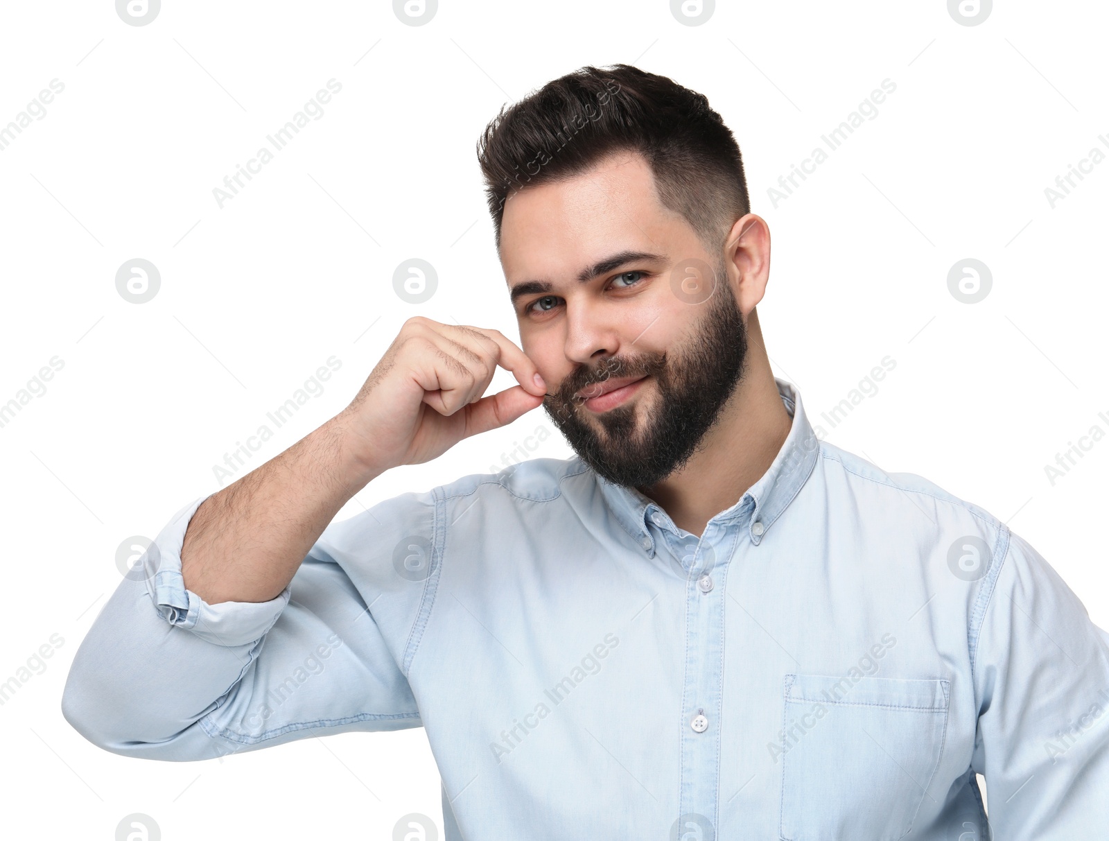 Photo of Happy young man touching mustache on white background