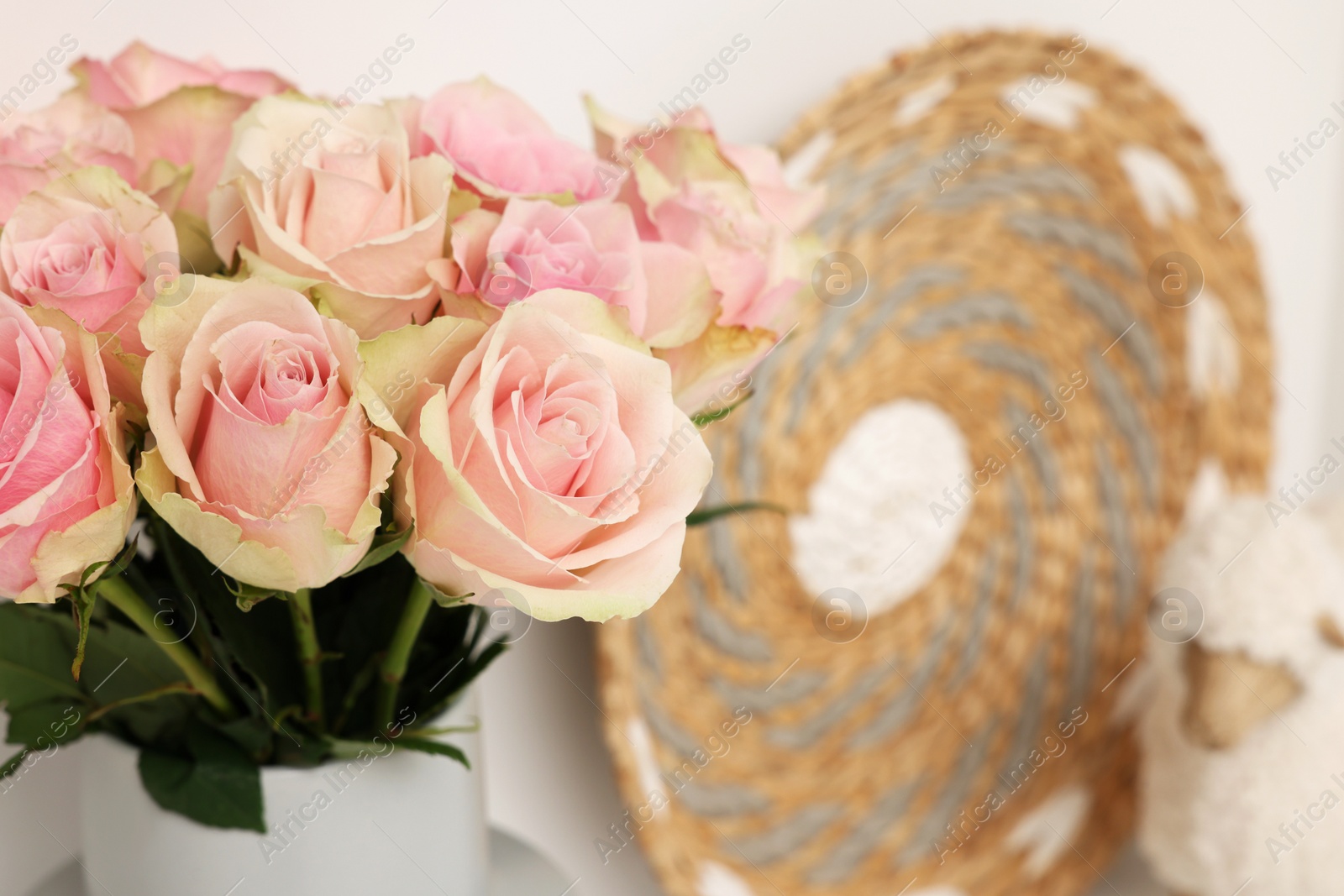 Photo of Beautiful rose flowers and decor, closeup with space for text. Interior design