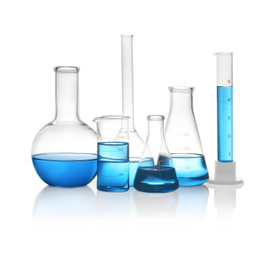 Photo of Different laboratory glassware with light blue liquid isolated on white