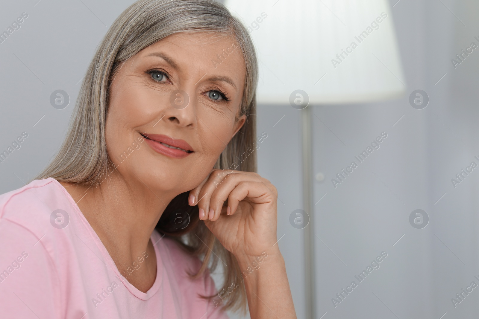 Photo of Portrait of beautiful senior woman at home. Space for text