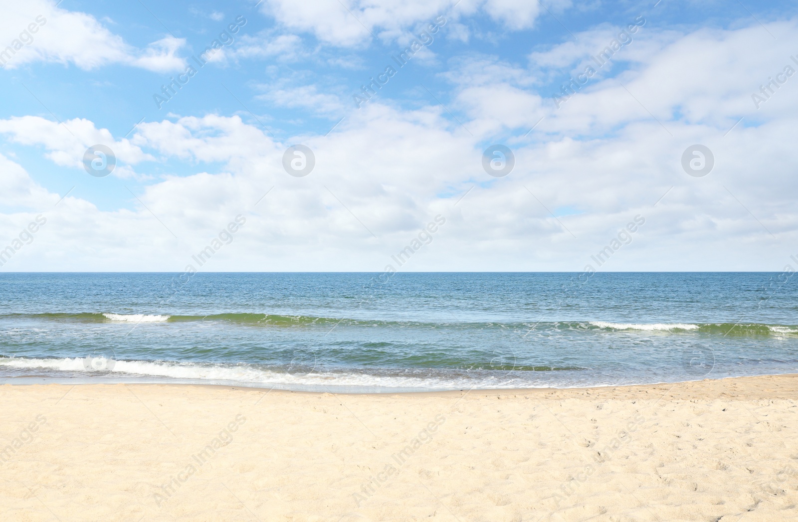 Photo of Picturesque view of sandy beach near sea