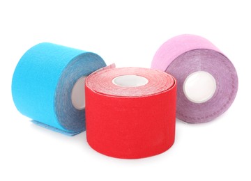 Many bright kinesio tape in rolls on white background