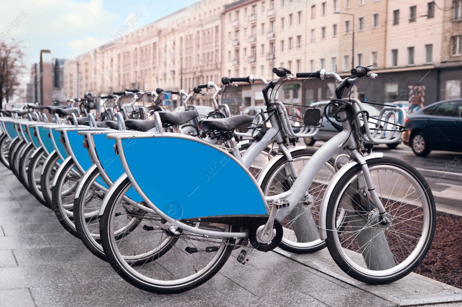 Photo of Many bicycles parked outdoors. Bike rental service