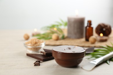 Composition with cosmetic product for spa body wraps on light wooden background