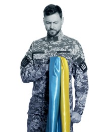 Image of Soldier in military uniform with Ukrainian flag on white background. Selective focus