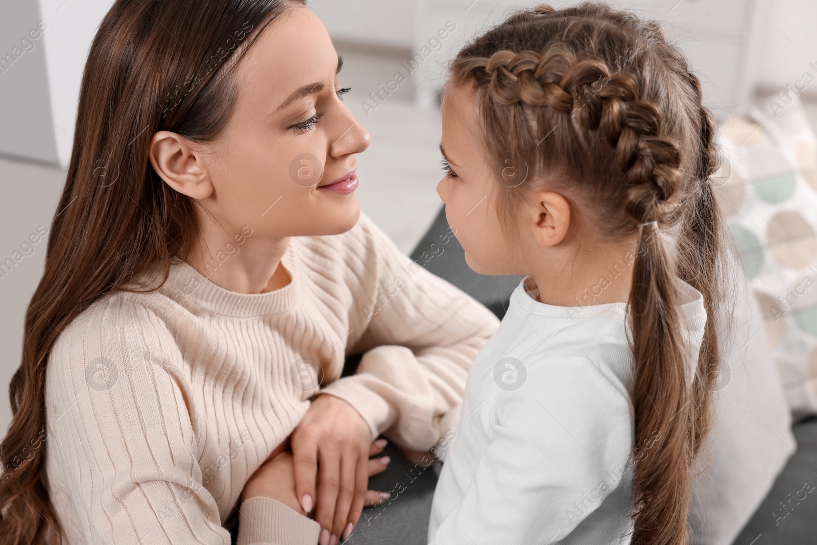 Photo of Happy mother with her cute daughter indoors