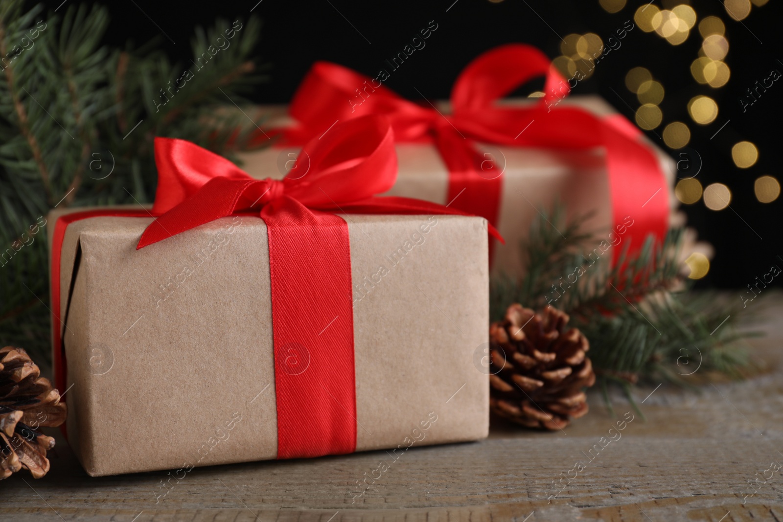 Photo of Gift boxes and Christmas decorations on wooden table