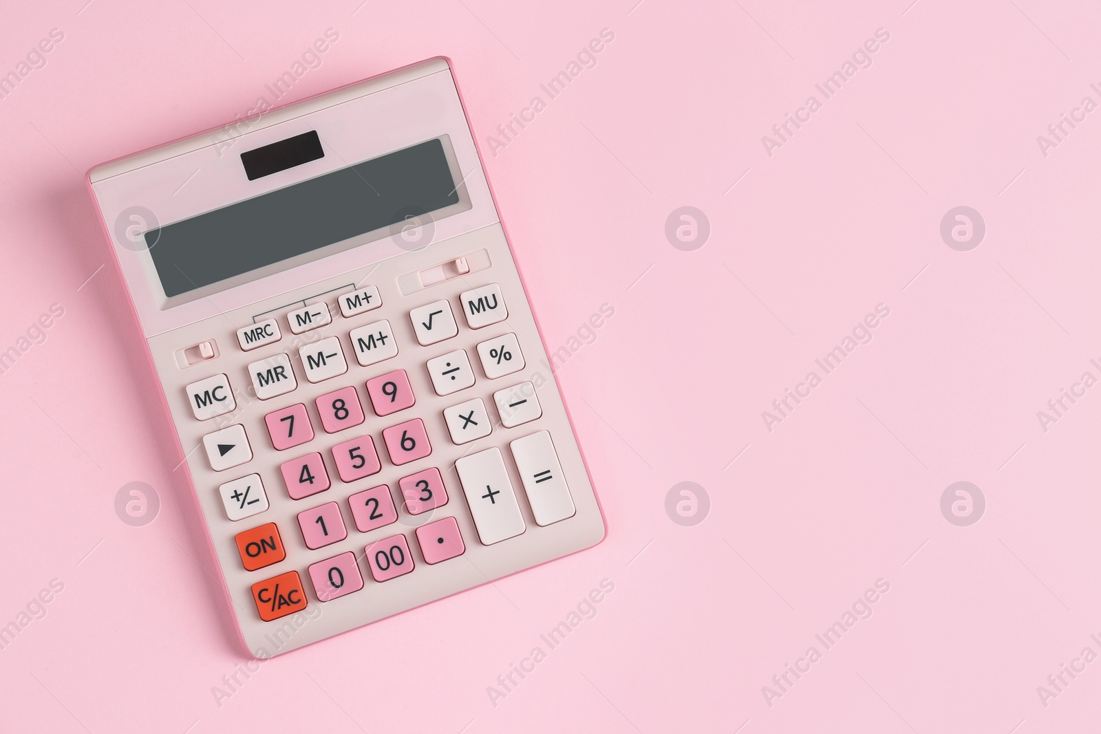 Photo of Modern calculator on pink background, top view. Space for text