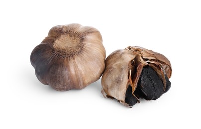 Photo of Bulbs of fermented black garlic isolated on white