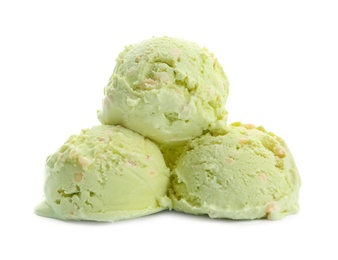 Photo of Scoops of delicious pistachio ice cream on white background