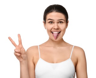 Photo of Happy young woman showing her tongue on white background