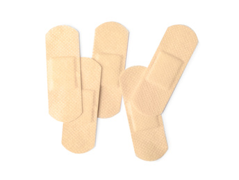 Photo of Medical sticking plasters isolated on white. First aid item