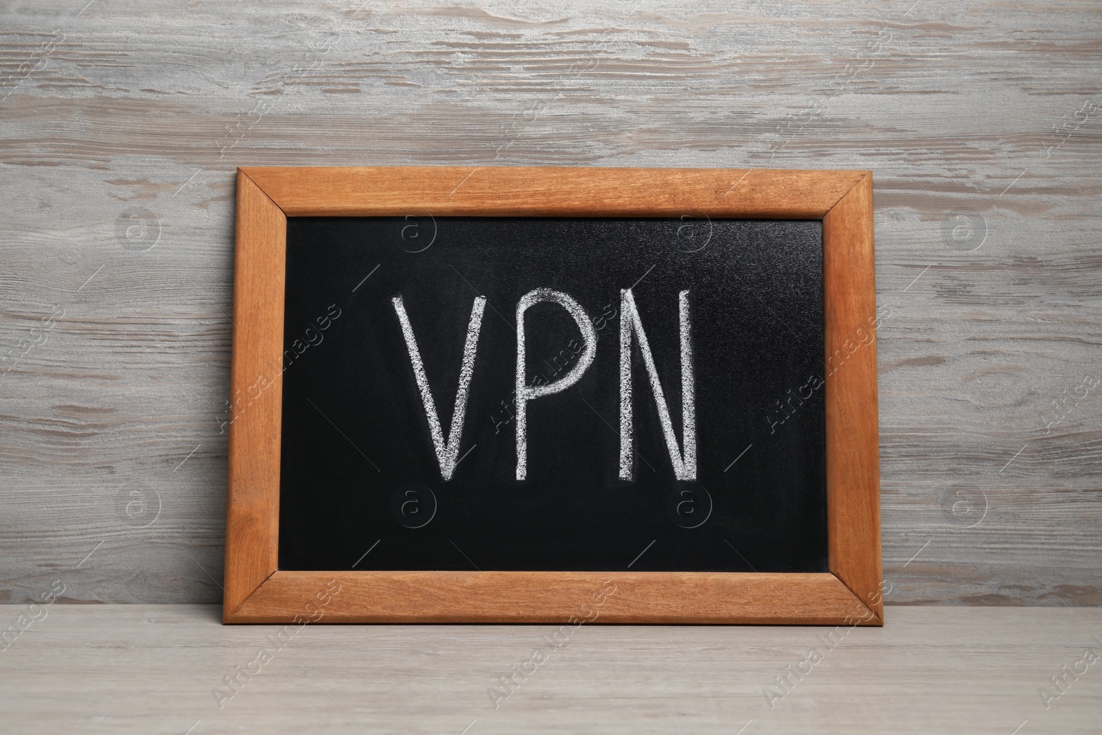 Photo of Chalkboard with acronym VPN on wooden table