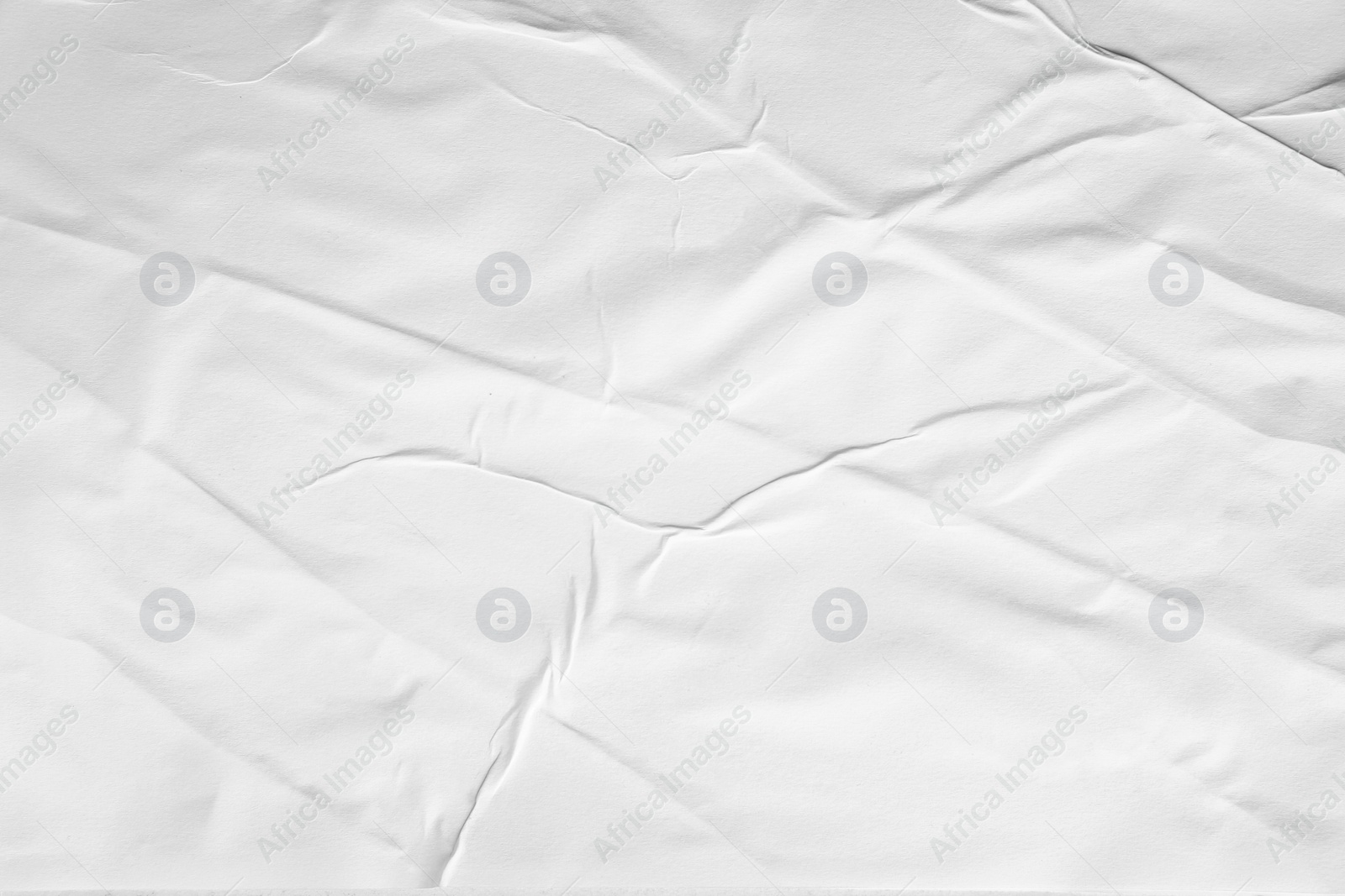 Photo of Texture of white creased paper, closeup view