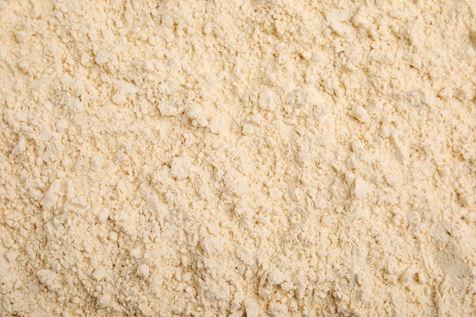 Photo of Closeup of chickpea flour as background, top view