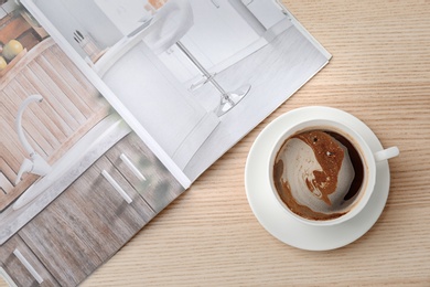 Creative flat lay composition with delicious hot coffee on table