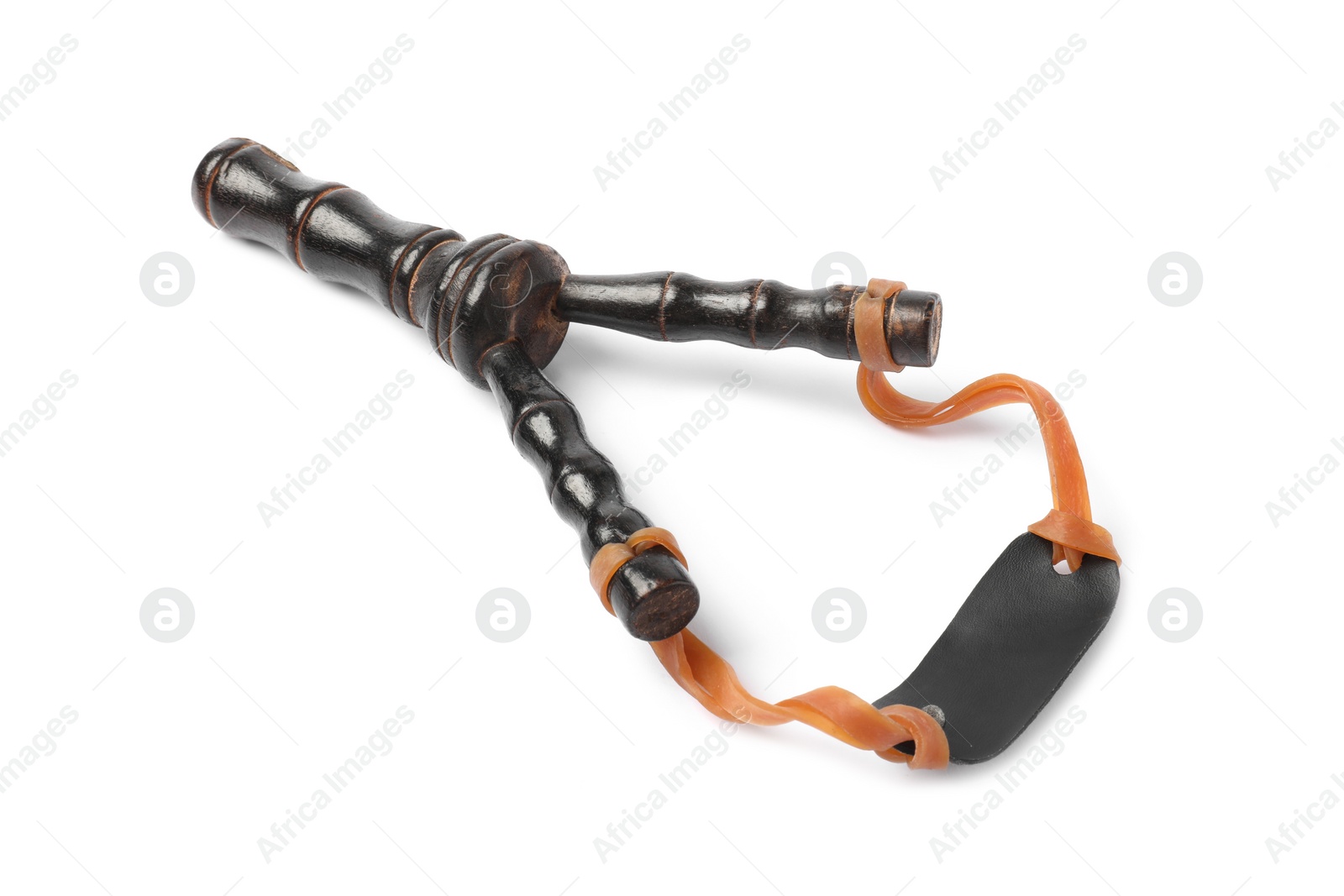 Photo of Black wooden slingshot with leather pouch on white background