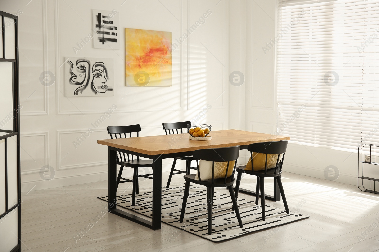 Photo of Stylish wooden dining table and chairs in room. Interior design