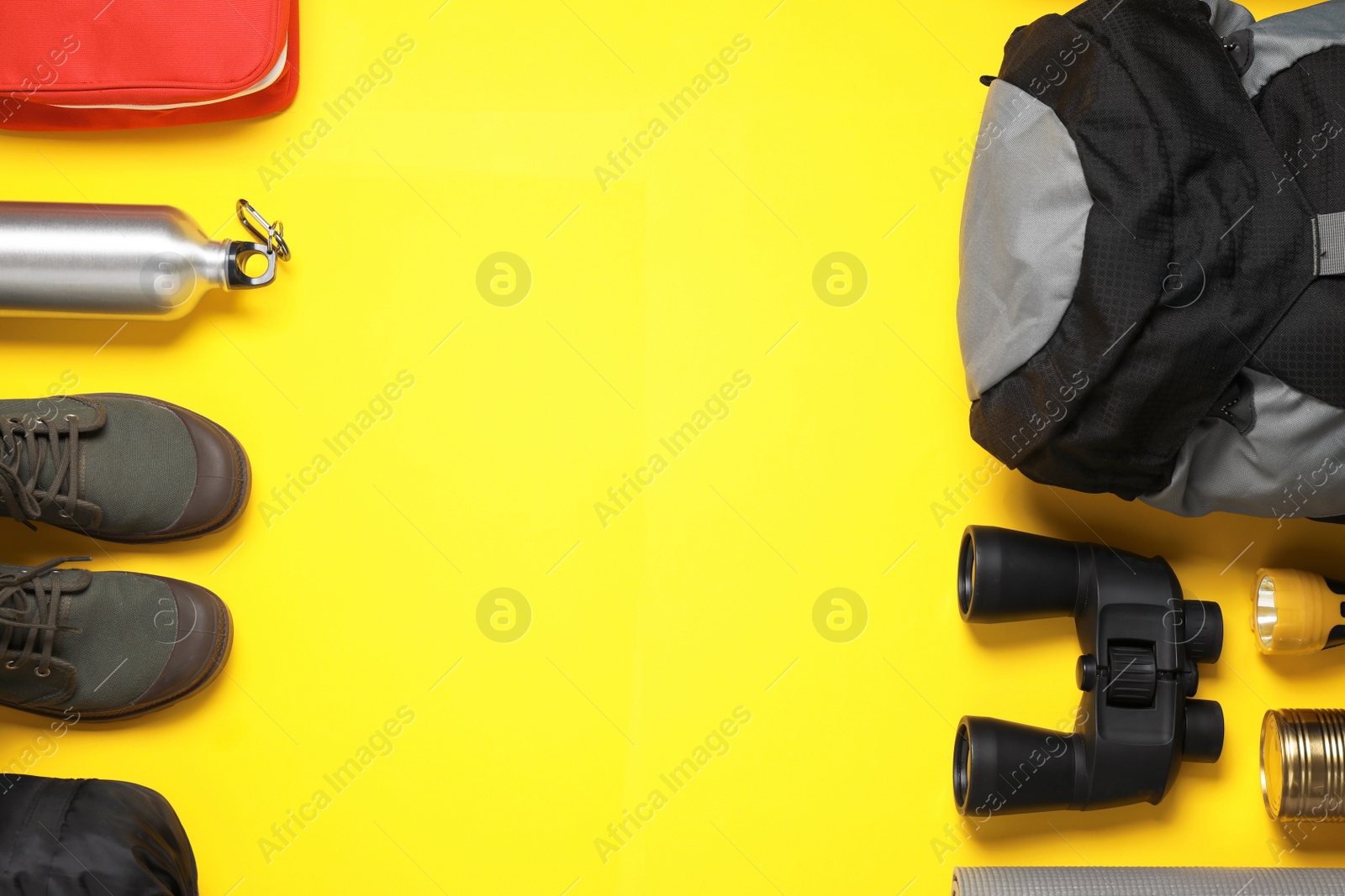 Photo of Flat lay composition with different camping equipment on color background, space for text