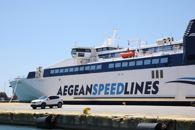 Photo of PIRAEUS, GREECE - MAY 19, 2022: Picturesque view of port with Speedrunner III vessel and car on sunny day