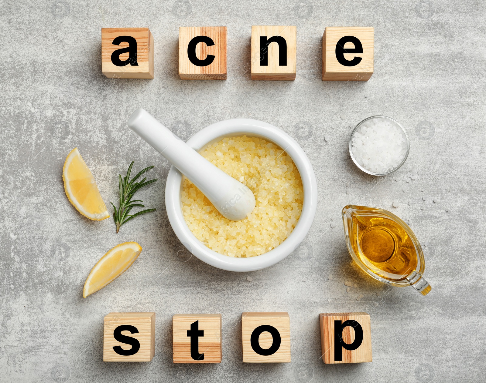 Photo of Wooden cubes with phrase "Stop acne" and homemade effective problem skin remedies on grey background, flat lay