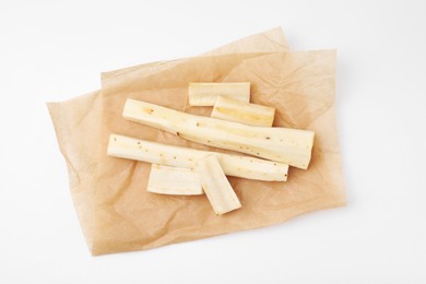 Photo of Cut raw salsify roots on white background, top view