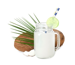 Photo of Mason jar with coconut water and nuts on white background