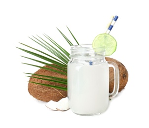 Mason jar with coconut water and nuts on white background