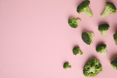 Photo of Flat lay composition with fresh green broccoli on color background. Space for text