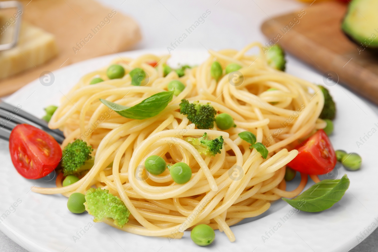 Photo of Plate of delicious pasta primavera, closeup view